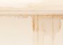Water damage assessment evidence identifying hidden water damage through visible water staining on an internal wall following flooding or stormwater ingress.